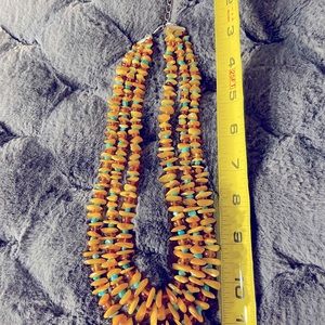 Triple strand necklace of Amber and Turquoise with sterling silver clasp.